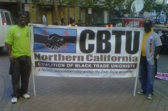 Carl Jones and Carl Jones Jr. hold the NCCBTU banner
